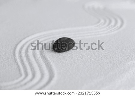 Zen Garden with Grey stone on White Sand Wave Pattern in Japanese stye, Rock Sea Stone on Sand texture with the wave parallel lines pattern,Harmony,Meditation,Zen like concept