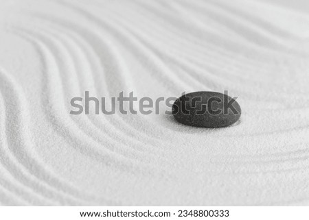 Zen Garden with Grey Stone on White Sand Line Texture Background, Top View Black Rock Sea Stone on Sand Wave Parallel Lines Pattern in Japanese stye, Simplicity Day, Meditation,Zen like concept	