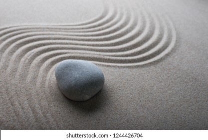 Zen Garden Meditation Stone Background. Stones And Lines In The Sand For The Balance Of Relaxation And Harmony Of Spirituality Or Spa Health