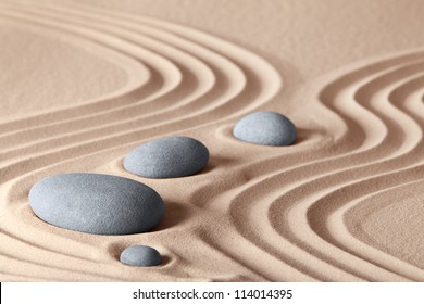 Zen Garden Stones In Row Pattern In Sand And Rocks For Relaxation And Concentration During Meditation