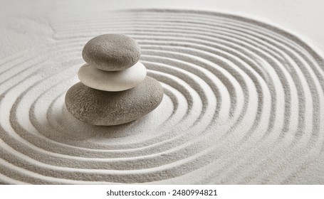 Zen garden with the stones and white sand pattern minimal scene Stack of Balanced Pebbles, zen pebbles, relax, massage, meditation, studio photography - Powered by Shutterstock