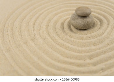 Zen sand garden meditation stone background with copy space. Stones and lines drawing in sand for relaxation. Concept of harmony, balance and meditation, spa, massage, relax. Set Sail Champagne color - Shutterstock ID 1886400985
