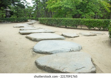 Zen stone path in a Japanese Garden, Takamatsu, Kagawa, Japan  - Powered by Shutterstock