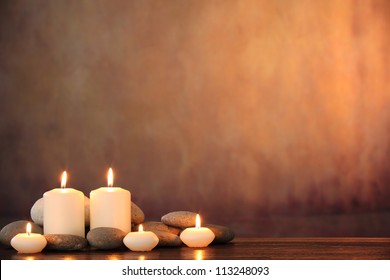 Zen stones and aromatic candles on table,Zen concept.