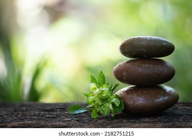 Zen stones and green rose or concourse rose on bokeh nature background. - Shutterstock ID 2182751215