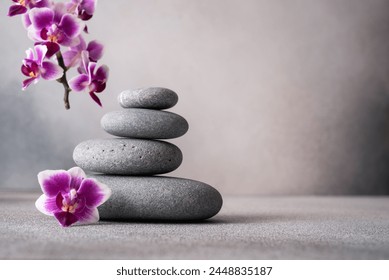 Zen stones and pink orchid flower on gray background with copy space, wellness and harmony, massage, spa and bodycare concept. - Powered by Shutterstock