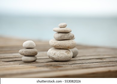 Zen Stones / Zen stone on beach for perfect meditation. Calm zen meditate background with rock pyramid on sand