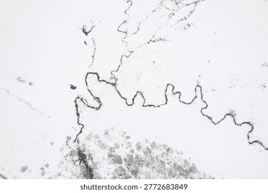 Zenith view of a river snaking through a snow-covered environment The Concept of serenity