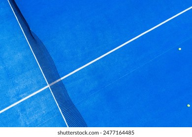 zenithal aerial view from a drone of a blue paddle tennis court - Powered by Shutterstock