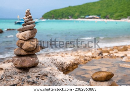 Zen-like stack stone formation captured in a serene moment, the concept of meditation, balance, relaxtion and spa treatment.