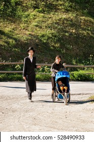 Zermatt, Switzerland - August 24, 2016: Family Of Orthodox Jews In Zermatt, Switzerland In Summer.