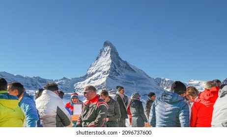 Zermatt, Switzerland - December 7 2019. People In Front Of The Matterhorn In Zermatt, Switzerland. Outdoor Ski Restaurant. 