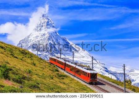 Zermatt, Switzerland. Gornergrat tourist train with Matterhorn mountain in the background. Valais region.