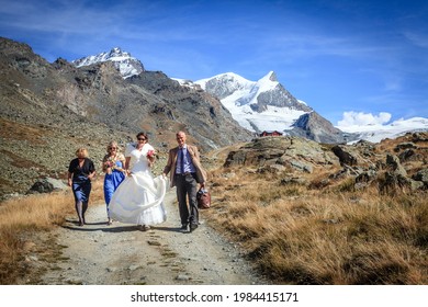 Zermatt, Switzerland, September 26, 2015: A Small Wedding Party On A Trail In Swiss Alps