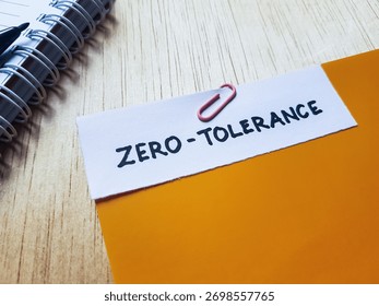 Zero - tolerance writting on table background.