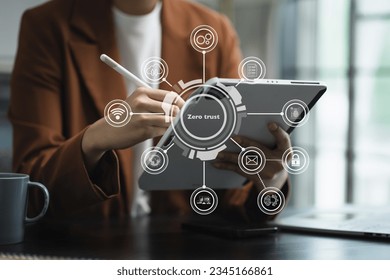 Zero trust security concept Person using computer and tablet with zero trust icon on virtual screen of Data businesses.in office.