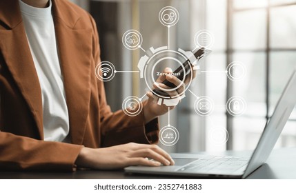 Zero trust security concept Person using computer and smartphone with zero trust icon on virtual screen of Data businesses.in office.