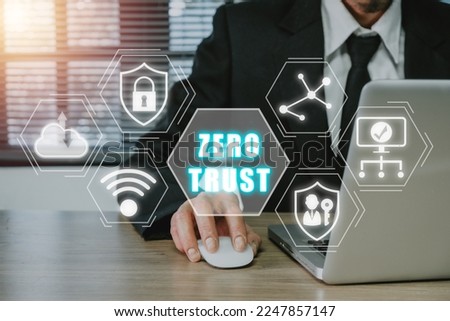 Zero trust security concept, Person using computer with zero trust icon on virtual screen.	

