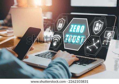 zero trust security concept, Person using computer with zero trust icon on virtual screen.