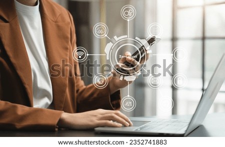 Zero trust security concept Person using computer and smartphone with zero trust icon on virtual screen of Data businesses.in office.
