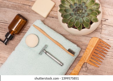 Zero Waste Bathroom Accessories, Metal Safety Razor, Wooden Comb, Deodorant, Shea Butter, Solid Soap, Wooden Toothbrush, Olive Oil Make Up Remover In A Glass Container, Nail Brush, Aloe Vera.