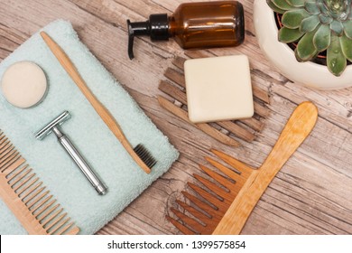 Zero Waste Bathroom Accessories, Metal Safety Razor, Wooden Comb, Deodorant, Shea Butter, Solid Soap, Wooden Toothbrush, Olive Oil Make Up Remover In A Glass Container, Nail Brush, Aloe Vera.