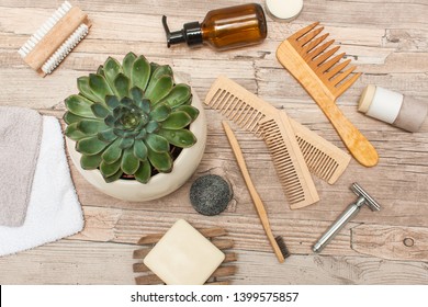 Zero Waste Bathroom Accessories, Metal Safety Razor, Wooden Comb, Deodorant, Shea Butter, Solid Soap, Wooden Toothbrush, Olive Oil Make Up Remover In A Glass Container, Nail Brush, Aloe Vera.