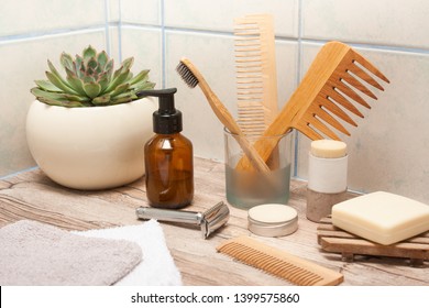 Zero Waste Bathroom Accessories, Metal Safety Razor, Wooden Comb, Deodorant, Shea Butter, Solid Soap, Wooden Toothbrush, Olive Oil Make Up Remover In A Glass Container, Nail Brush, Aloe Vera.