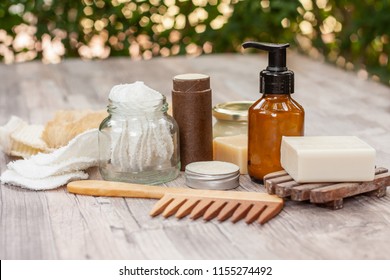 Zero waste bathroom accessories, natural sisal brush, wooden comb, deodorant, shea butter, solid soap and shampoo bars, reusable cotton make up removal pads, make up remover in a glass container. 