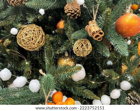 Zero waste christmas concept. Christmas tree decorated with ornaments made of natural materials - slices of dried orange and cones