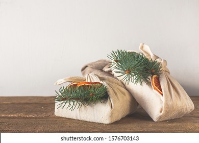 Zero waste, Christmas eco-friendly gift wrapping in traditional Japanese Furoshiki style, environmental gift wrapping concept, eco friendly banner	 - Powered by Shutterstock