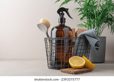 Zero waste cleaning supplies basket with spray glass bottle. Concept of natural cleaning products
