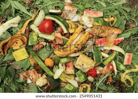 Zero waste, composting concept. Compost pile in garden close up. Bio waste, vegetables and fruits food scraps background, texture