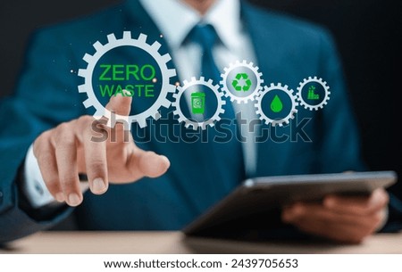 Zero waste concept. Reducing waste to zero, Ecological call for recycling and reuse, Sustainable lifestyle. Businessman touching zero waste icon on virtual screen.