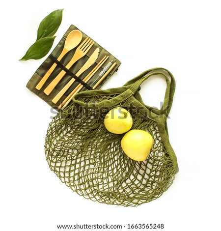 Zero waste concept. Set of bamboo appliances, apples and eco bag. No plastic. Place for text.