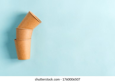 Zero Waste eco friendly paper disposable mockup cups above pastel blue background.
