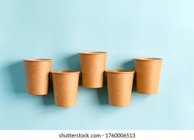 Zero Waste eco friendly paper disposable mockup cups above pastel blue background.