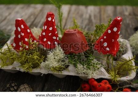 Zero waste fall craft using natural objects and recycled materials to make a mushroom.