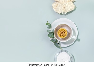 Zero waste kitchen cleaning concept. Eco friendly natural cleaning dishes with bamboo dish brushes, baking soda and sprig of eucalyptus. No plastic, eco-friendly lifestyle. Top view, copy space - Shutterstock ID 2258157871