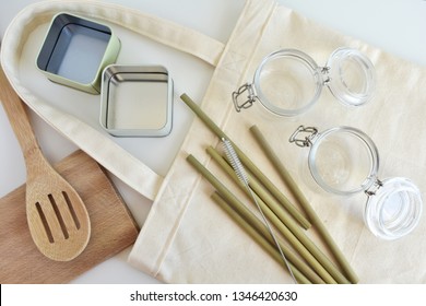 Zero Waste Kitchen, Reusable Shopping Bag, Glass Jars And Metal Boxes For Storage, Metal Boxes, Wooden Utensils, Bamboo Drinking Straws, Top View.