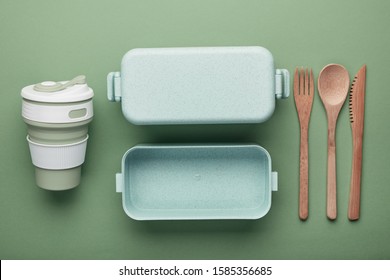 Zero Waste Lunch Concept. Reusable Cup And Box, Bamboo Cutlery. Flat Lay On Green Background