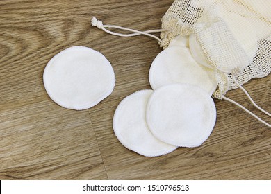 zero waste organic cotton reusable pads for make up removal on wooden table
