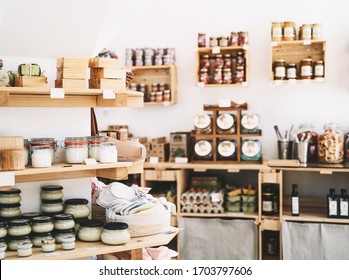 Zero Waste Shop Interior Details. Wooden Shelves With Different Food Goods And Personal Hygiene Or Cosmetics Products In Plastic Free Grocery Store. Eco-friendly Shopping At Local Small Businesses