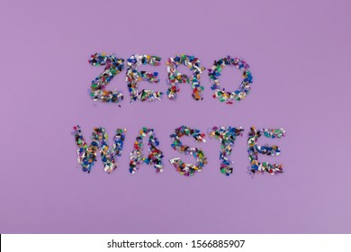 Zero Waste Text Consisting Of Small Recycled Plastic Pellets Collected From The Sea Water. Rethinking The Environment By Reducing Or Reusing Plastics. Circular Economy Concept. Flatlay, Lilac Purple