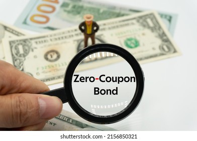 Zero-Coupon Bond.Magnifying glass showing the words.Background of banknotes and coins.basic concepts of finance.Business theme.Financial terms. - Shutterstock ID 2156850321