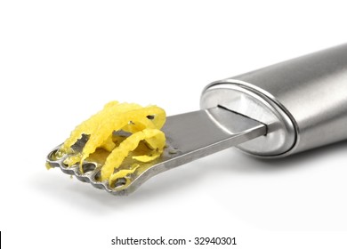 Zester With Lemon Zest, On White Background.