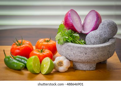 Zesty salsa with tomato and peppers, pico de gallo molcajete (mortar) and tejolete (pestle)
