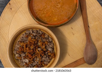 Zganci Food National In Slovenia On Wooden Old Table In Nature Of Velika Planina In Summer