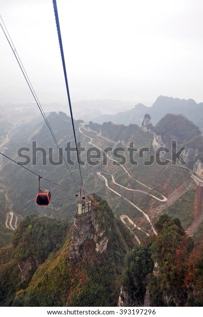 ZHANGJIAJIE CHINA - MAR 5, 2016 :  Tianmen\
Mountain Cable car are moving from nearby Zhangjiajie railway\
station to the top of the mountainstation. It is the longest\
passenger cableway in the\
world.