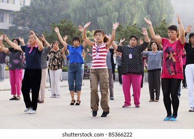 ZHAOJIAKOU, CHINA - SEPT. 4, 2011. Morning Group Exercise On Sept. 4, 2011. Mass Exercise Make Come Back In China. Netizens Call The Move A Return To The Practices Of The Cultural Revolution.